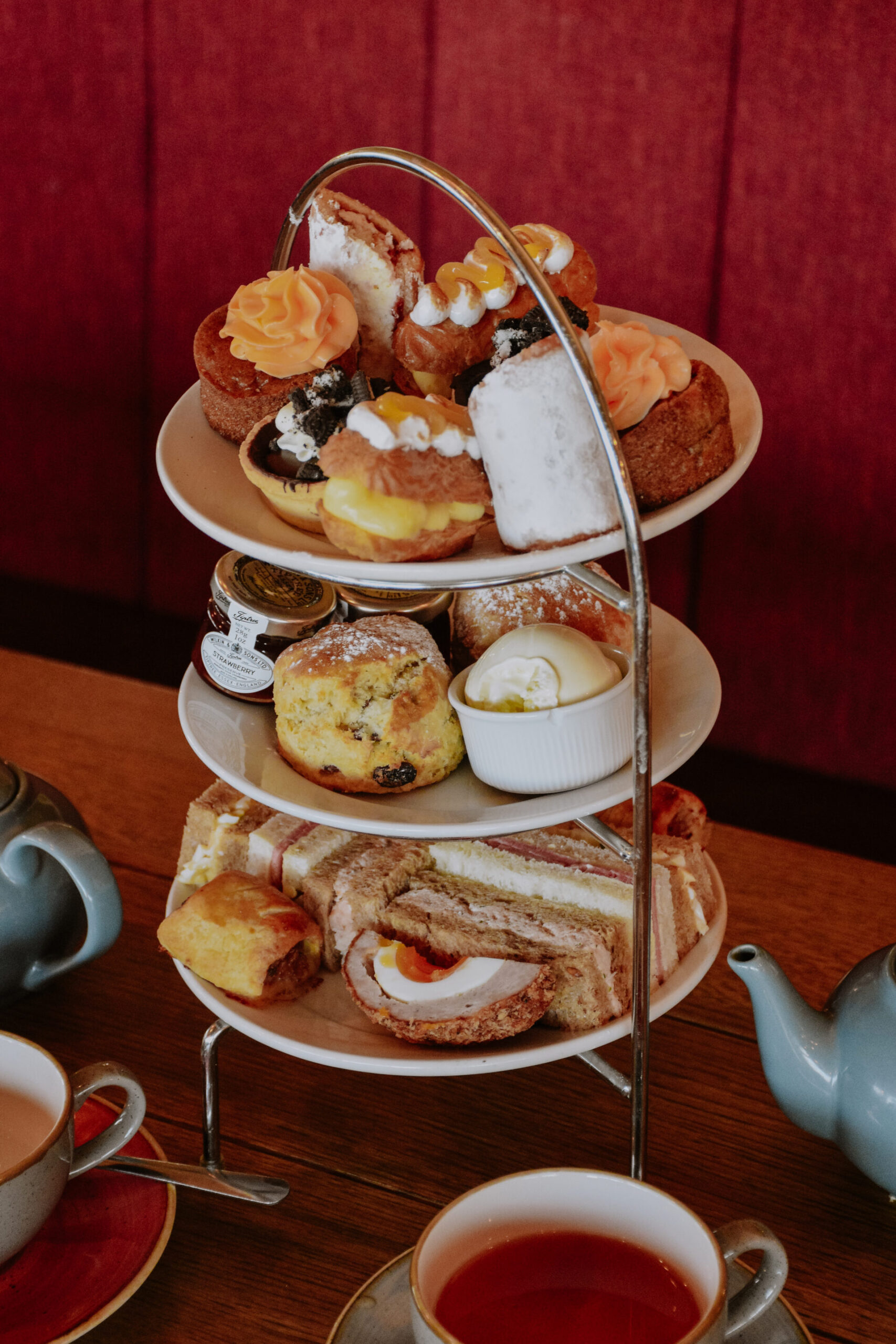 Afternoon Tea Gift Card: Enjoy a classic tiered stand of pastries, scones & sandwiches at a charming table.