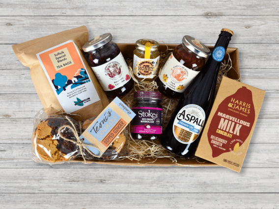 The Classic Hamper (NEW): tea, biscuits, honey, jam, chutney, cider, milk chocolate & cheddar cheese.